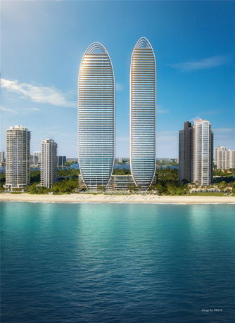 Front view of two modern high-rise buildings by the waterfront.