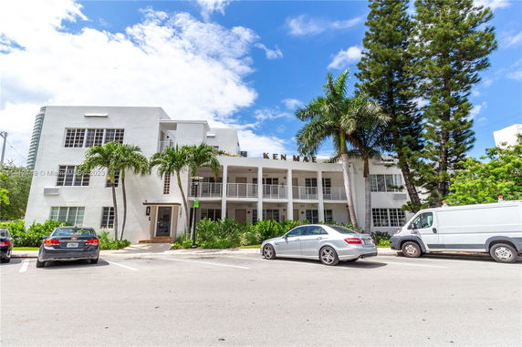 Front view of a multi-story building with balconies.