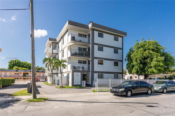 Front view of a four-story apartment building.
