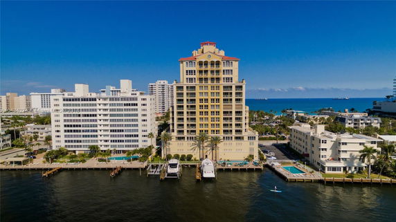 Front view of a multi-story building by the waterfront.