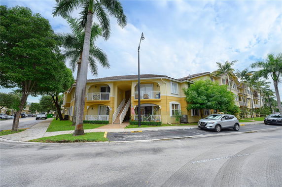 Front view of a two-story residential building with balconies.