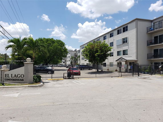 Front view of a multi-story condominium building.