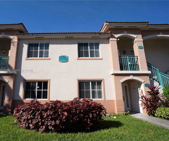 Front view of a two-story residential building with balconies.