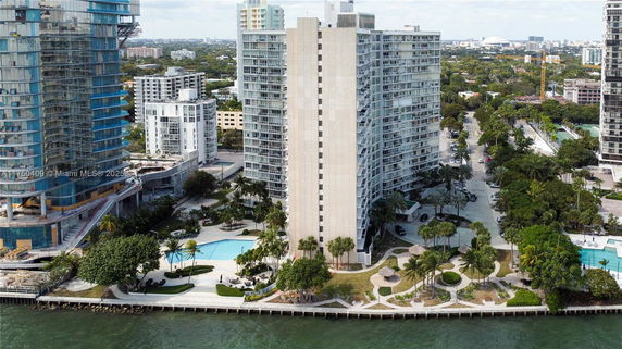Front view of a high-rise residential building near the waterfront.