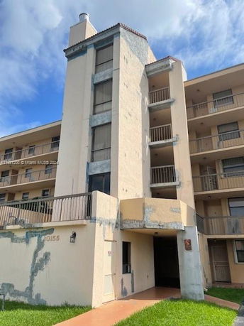Front view of a multi-story residential building.