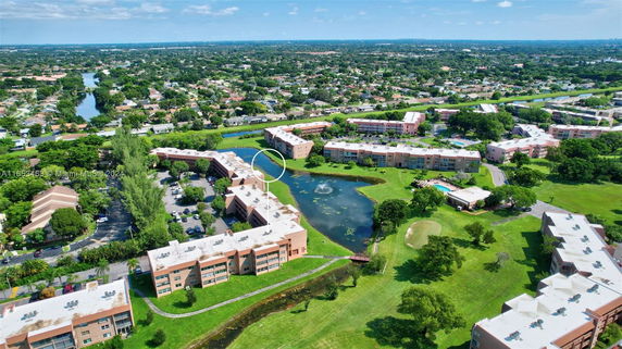 Aerial view of residential buildings with surrounding areas visible.