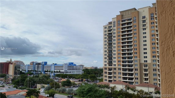 Panoramic view of a cityscape with tall residential and commercial buildings.