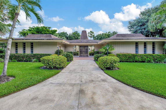 Front view of a single-story house with a unique roof design.