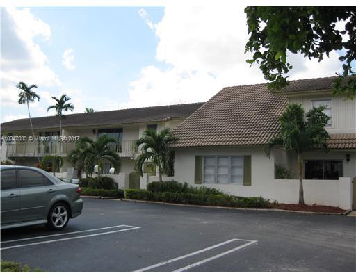 Front view of a two-story building with a tiled roof.