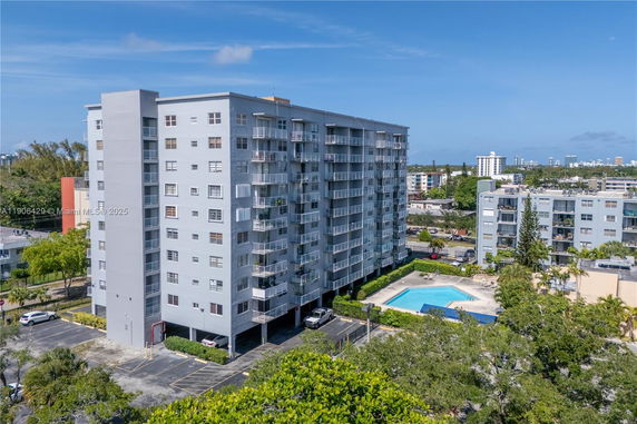 Front view of a multi-story residential building with balconies.