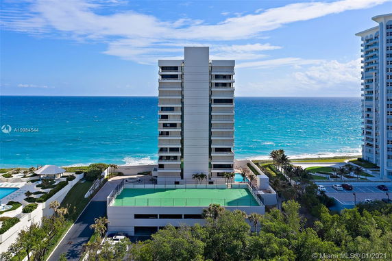 View of a high-rise building overlooking the ocean.
