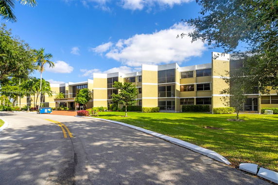 Front view of a multi-story residential building with a modern design.