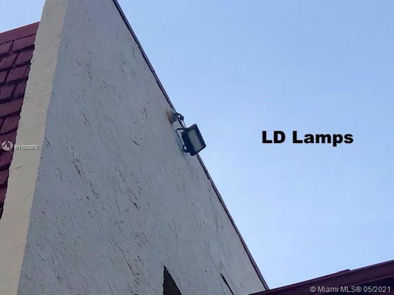 Roofline view of a building with LD Lamps installed.