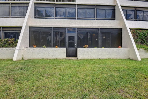 Front view of a building with large windows and angled exterior walls.