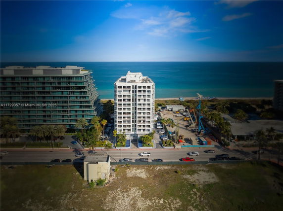 Front view of a multi-story beachfront building.