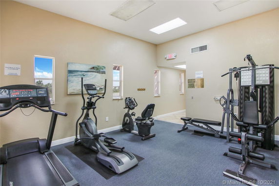 Indoor gym area with various exercise equipment.