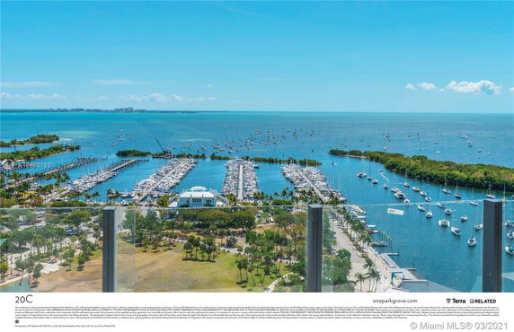 Panoramic view of a marina and ocean from a high vantage point.