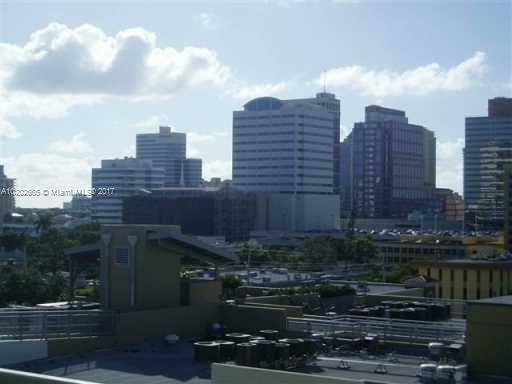 Panoramic view of city skyline with multiple skyscrapers and buildings.