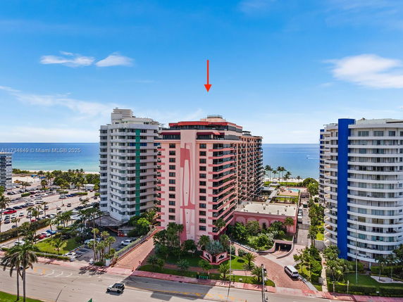 Aerial view of coastal high-rise buildings with ocean in the background.