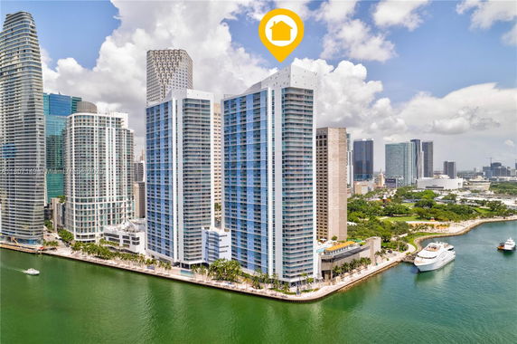 Elevated view of modern high-rise buildings by the waterfront.