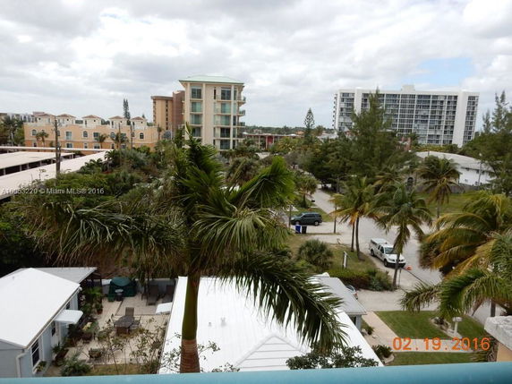 View of surrounding area with multiple residential and commercial buildings.