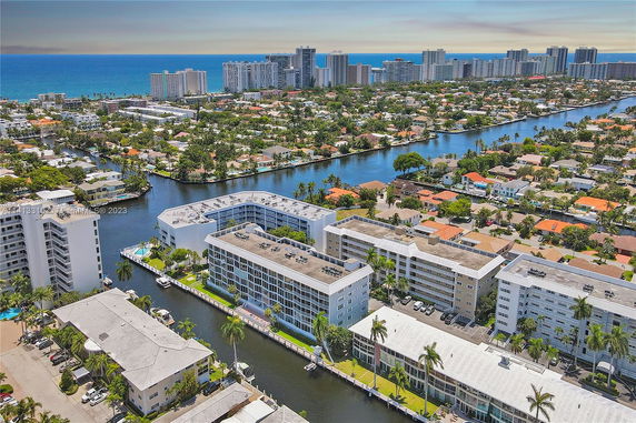 Panoramic view of coastal city with canals, buildings, and shoreline.