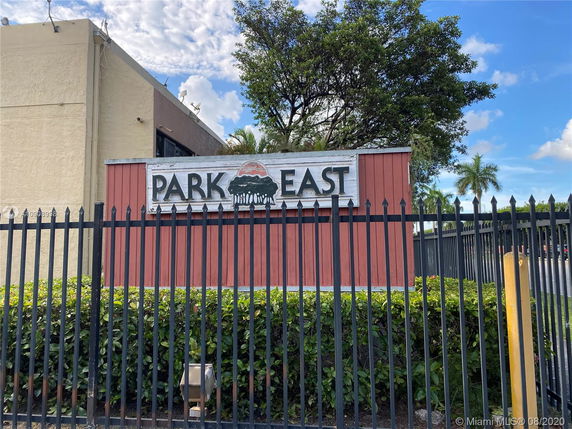 Front view of a single-story building with a sign reading 'Park East'.