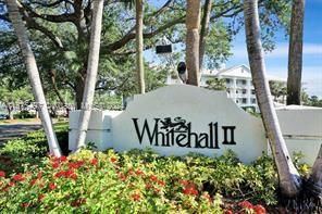 Sign with 'Whitehall II' in front of trees and a building in the background.