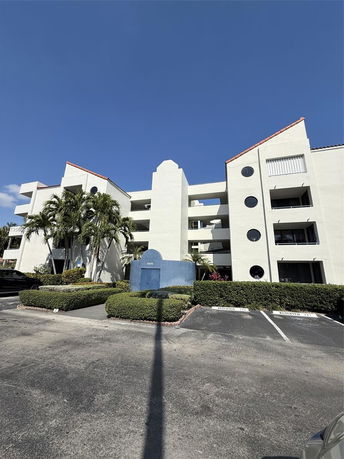 Front view of a multi-story building with unique architectural design.