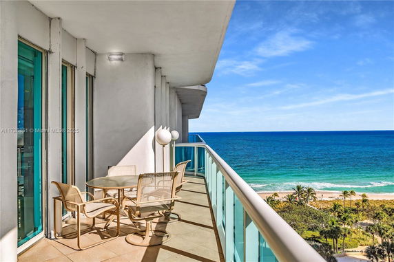 Balcony view of the ocean from a high-rise building.