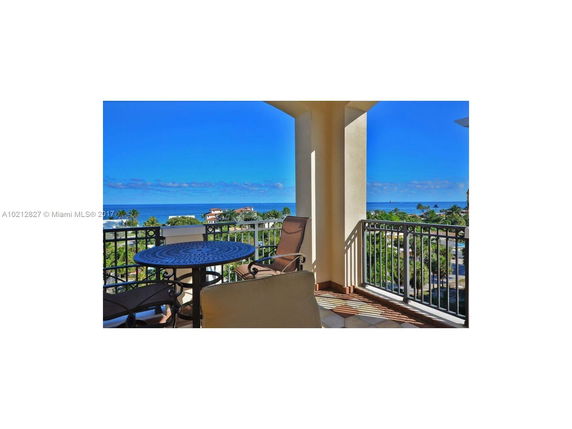 Panoramic view from a balcony overlooking the ocean and surrounding area.