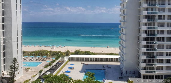 View of the ocean and buildings from a high vantage point.