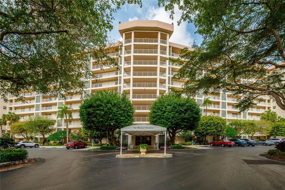 Front view of a multi-story residential building with balconies.