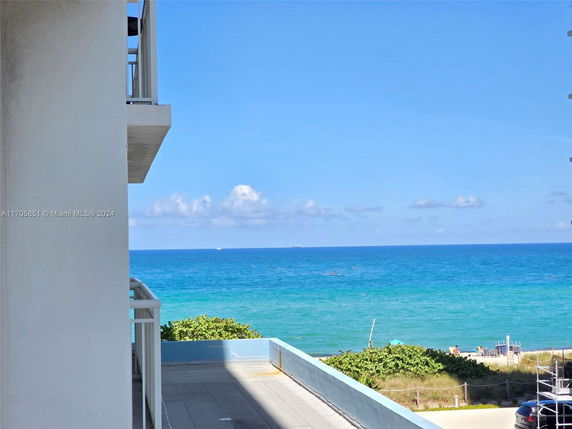 View from a building showing the ocean and beach area.
