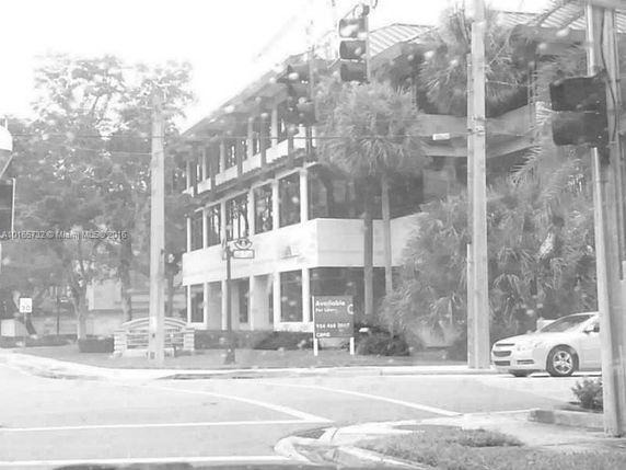 Front view of a two-story building at a street corner