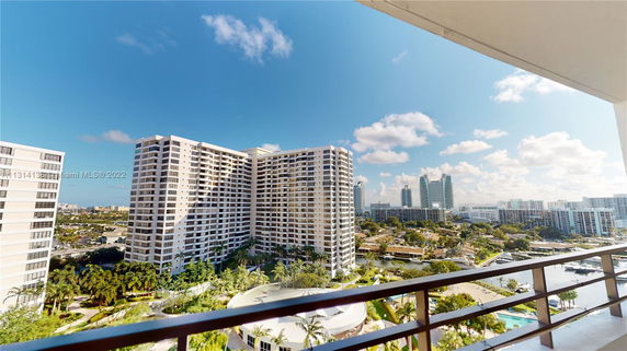 Wide-angle view of multiple high-rise buildings with clear skies.
