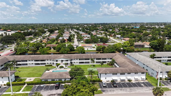 Aerial view of a residential neighborhood with multiple buildings and greenery.