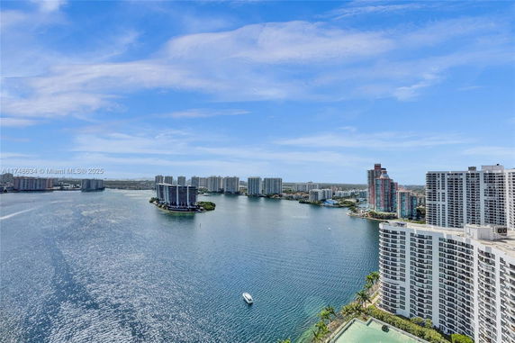 Scenic view of a city skyline along a large body of water.