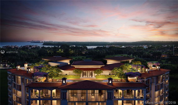 Night view of a building with a rooftop garden, featuring lush greenery and architectural elements.