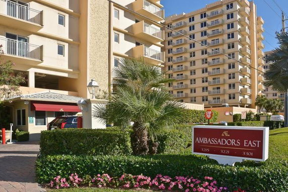 Front view of a multi-story residential building named Ambassadors East.