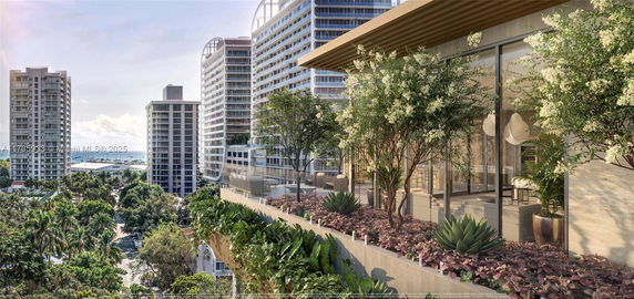 Panoramic view of high-rise buildings with a terrace featuring plants and seating area.