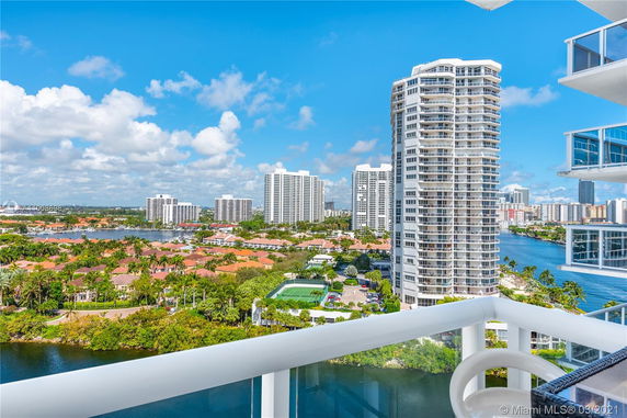 View of cityscape with multiple high-rise buildings and waterways.