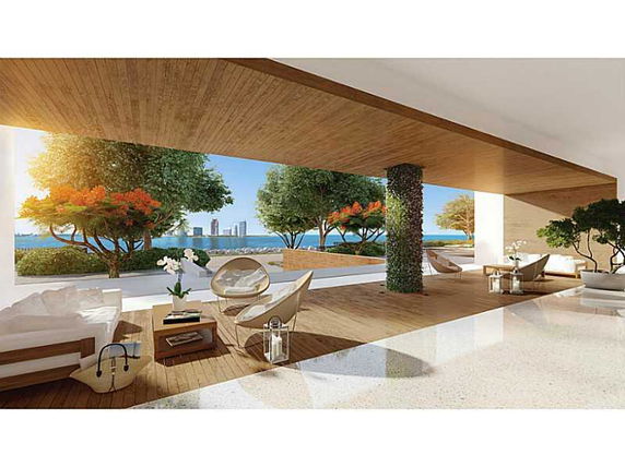 Outdoor area with modern seating and a view of the city skyline in the distance.