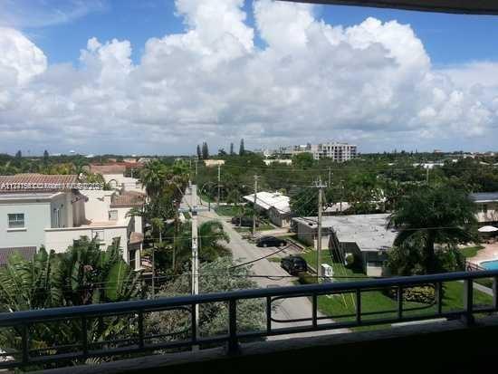 Panoramic view of residential area and roads from a rooftop or balcony.