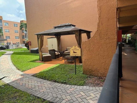 Outdoor area near a building with a pavilion and seating.