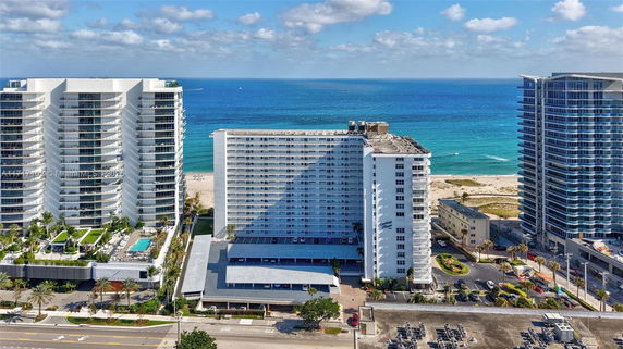 Front view of a multi-story beachfront building.