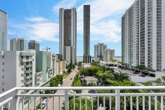 View of modern high-rise buildings from a balcony.