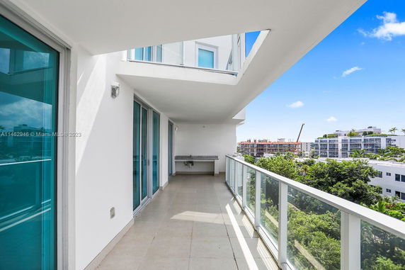 Balcony view of modern buildings and greenery
