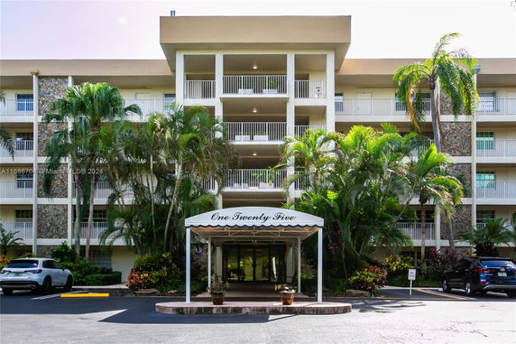 Front view of a multi-story building with balconies and a covered entrance labeled 'One Twenty Five'.