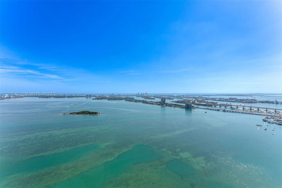 Wide-angle view of a coastal city with islands and waterways.